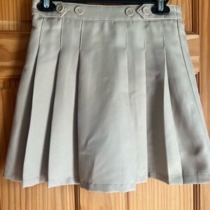 Izod Schoolwear Button-Detail Pleated Mini Skirt in Tan. Great condition. Size14